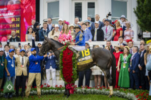 Sovereignty with jockey Junior Alvarado up in the Kentucky Derby winners circle.