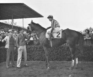 Market Wise, with Wendell Eads up, wins the McLennan Handicap.