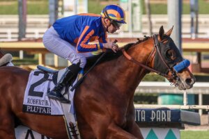 Plutarch wins the Robert B. Lewis at Santa Anita.