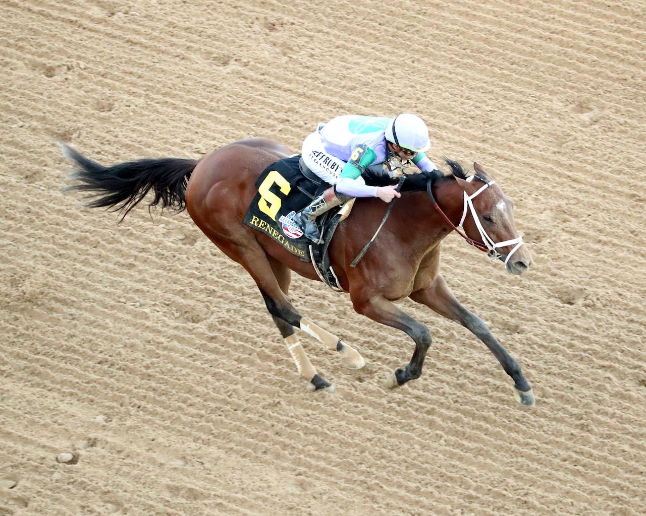 Renegade wins the Arkansas Derby at Oaklawn Park.