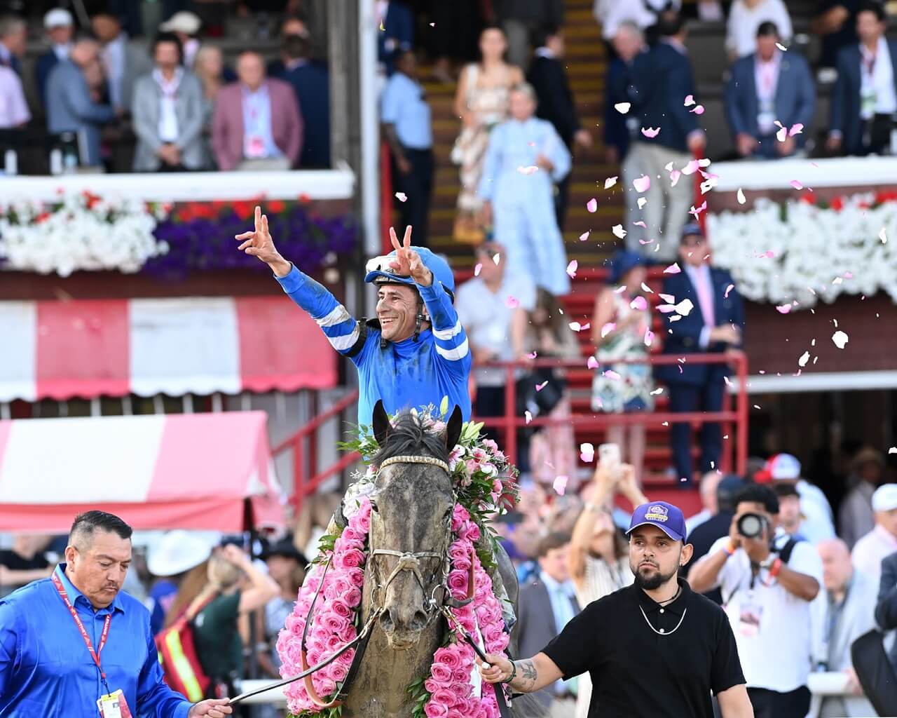 Jockey Junior Alvarado celebrates Sovereignty's Whitney (G1)